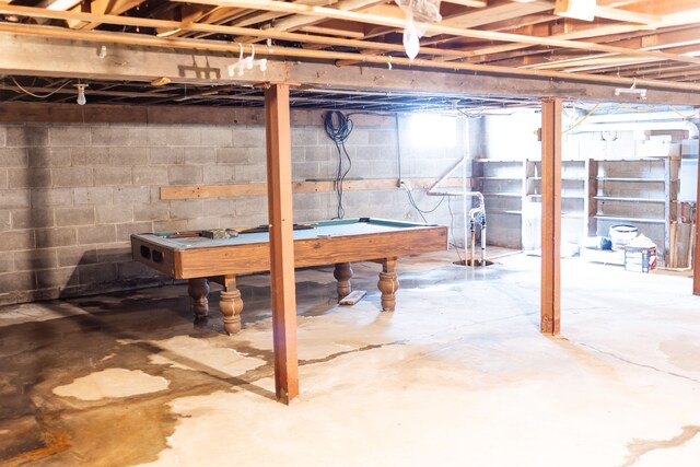 unfinished below grade area featuring pool table