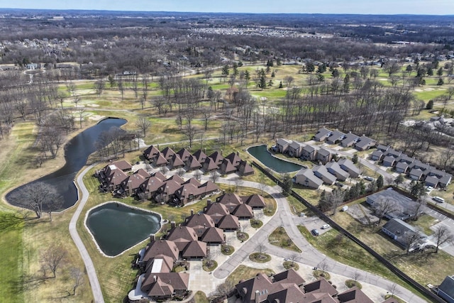 drone / aerial view with a residential view and a water view