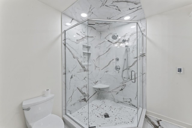 full bathroom with toilet, baseboards, marble finish floor, and a marble finish shower