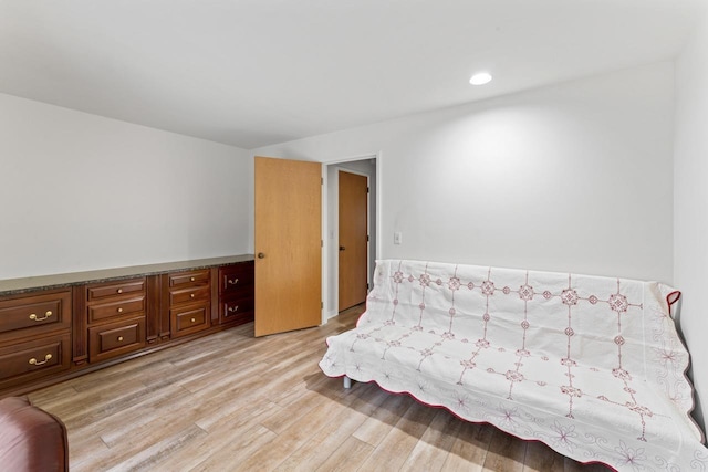 bedroom featuring recessed lighting and light wood-style flooring