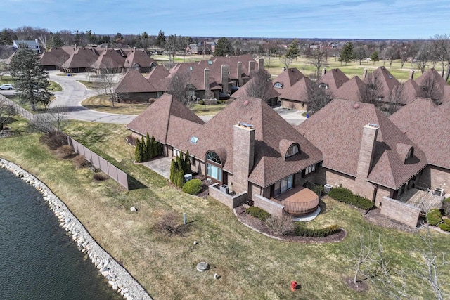 aerial view with a residential view and a water view