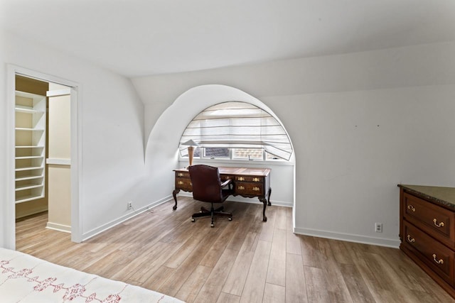 office space featuring light wood-style floors and baseboards