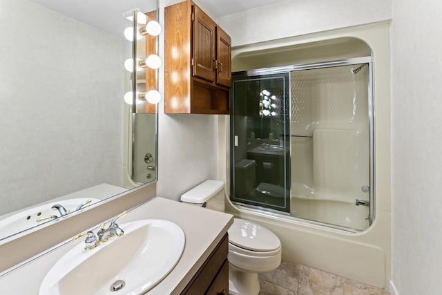 full bathroom featuring vanity, toilet, and bath / shower combo with glass door