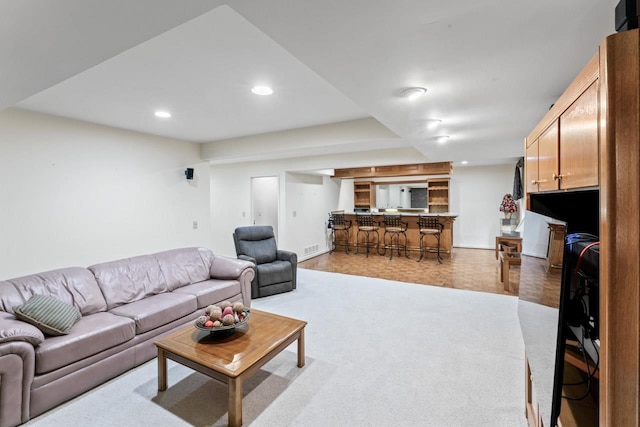 living area with recessed lighting and baseboards