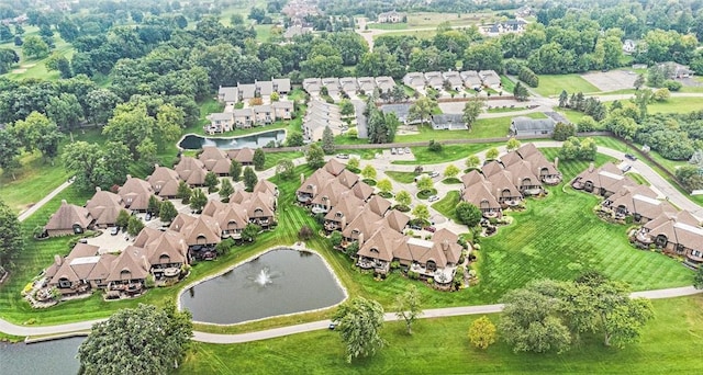 birds eye view of property featuring a residential view and a water view