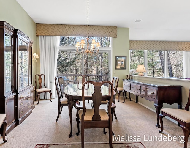 carpeted dining space with a notable chandelier