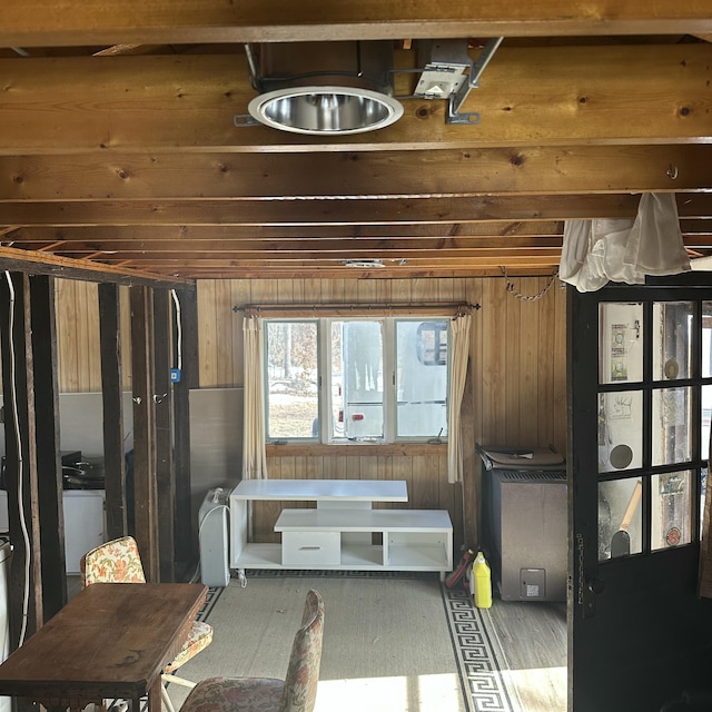 interior space featuring wooden walls and wood finished floors