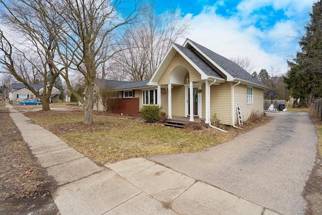 view of front of home featuring roof with shingles