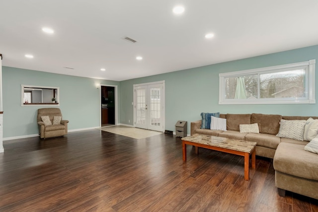 living area with wood finished floors, visible vents, baseboards, recessed lighting, and french doors