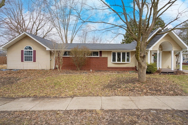 single story home with brick siding