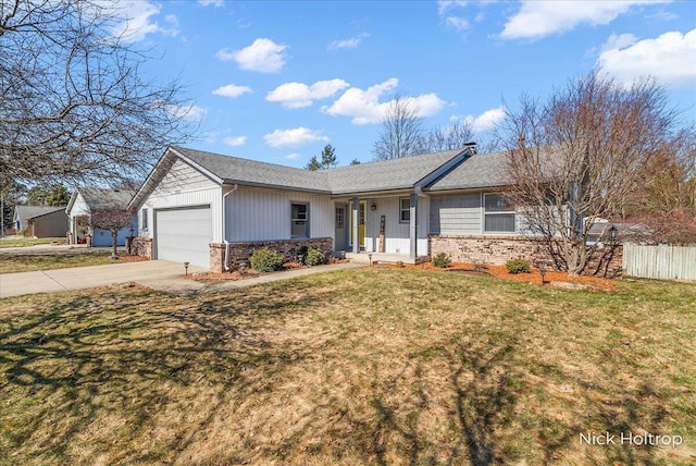 single story home with driveway, fence, an attached garage, a front yard, and brick siding