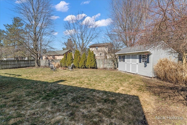 view of yard with an outbuilding and a fenced backyard