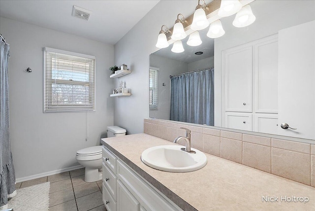 full bathroom featuring visible vents, toilet, tile patterned flooring, baseboards, and vanity