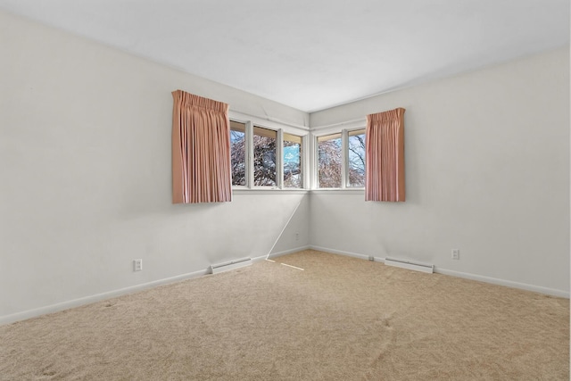 unfurnished room featuring carpet flooring, a baseboard heating unit, and baseboards