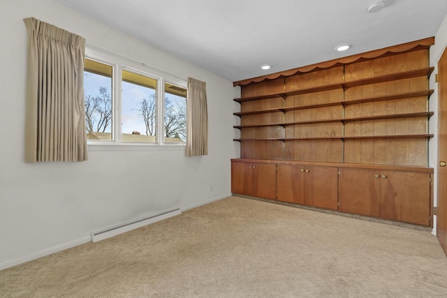 unfurnished room with recessed lighting, a baseboard heating unit, baseboards, and light colored carpet