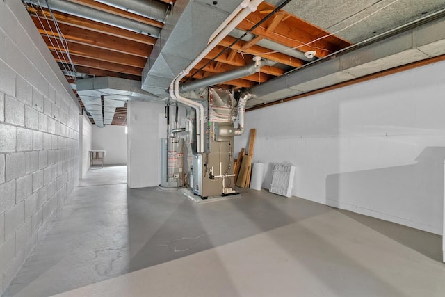 unfinished basement with gas water heater and heating unit