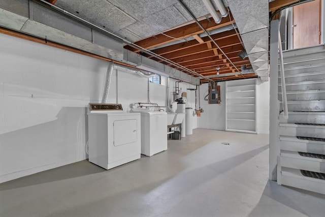 basement featuring independent washer and dryer and stairs