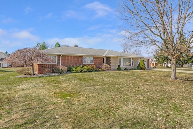 single story home with brick siding, a chimney, and a front lawn