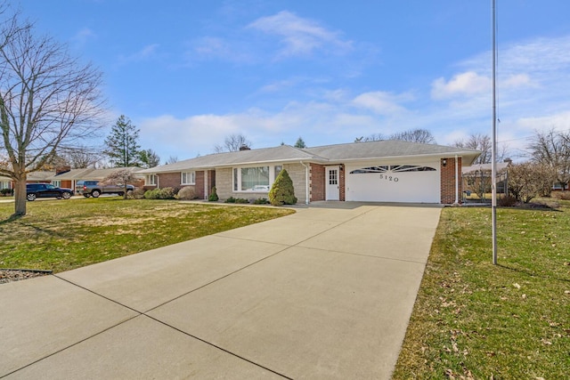 ranch-style house with a front lawn, an attached garage, brick siding, and driveway