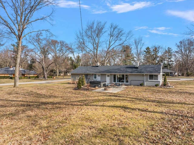 view of front of home featuring a patio area and a front lawn