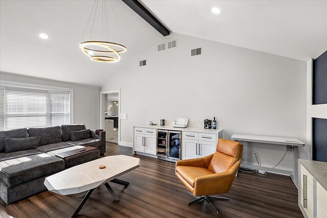 living room with visible vents, beam ceiling, beverage cooler, and dark wood finished floors