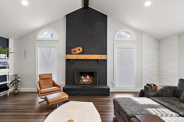 living room featuring high vaulted ceiling, wood finished floors, recessed lighting, a fireplace, and baseboards