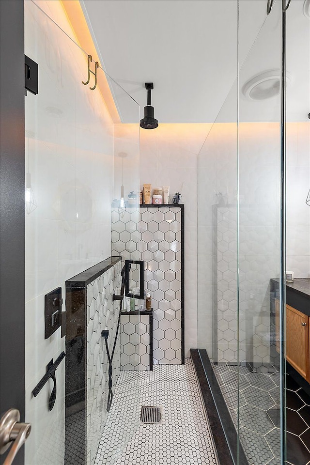 bathroom featuring tile patterned flooring and walk in shower