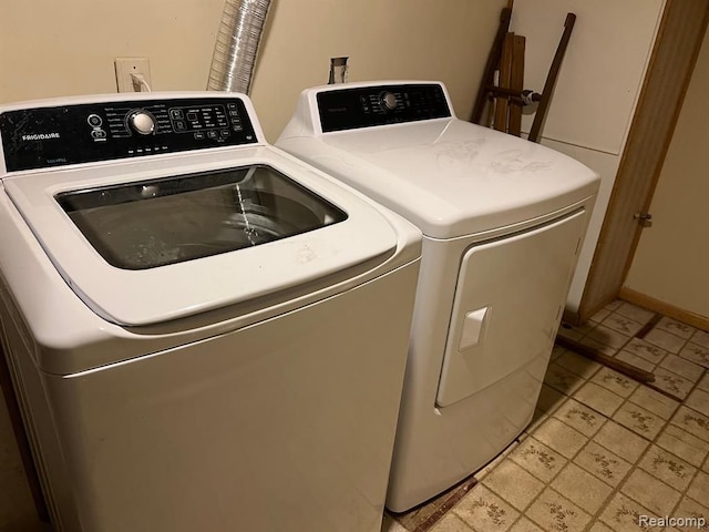 laundry area featuring laundry area and washing machine and dryer