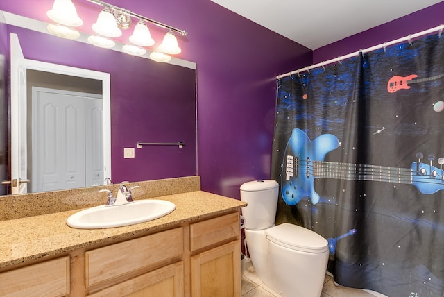 full bath with tile patterned floors, toilet, and vanity