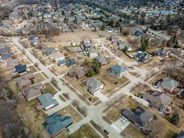 birds eye view of property with a residential view and a water view