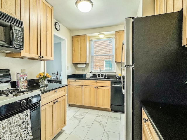 kitchen with marble finish floor, black appliances, light brown cabinetry, a sink, and dark countertops