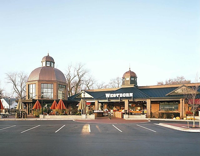 view of property with uncovered parking