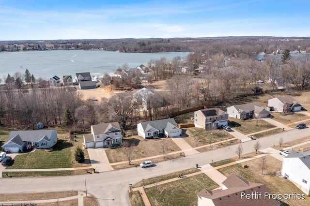 aerial view with a residential view and a water view