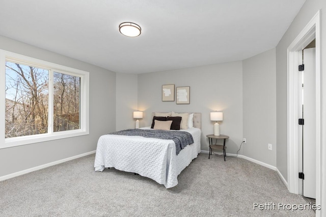 carpeted bedroom with baseboards