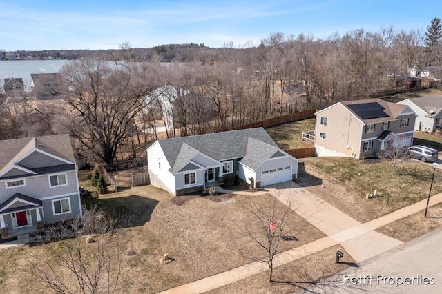 birds eye view of property with a residential view