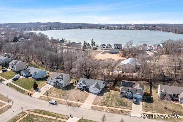 aerial view with a water view and a residential view