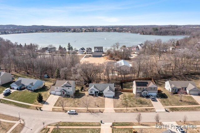 aerial view with a water view and a residential view