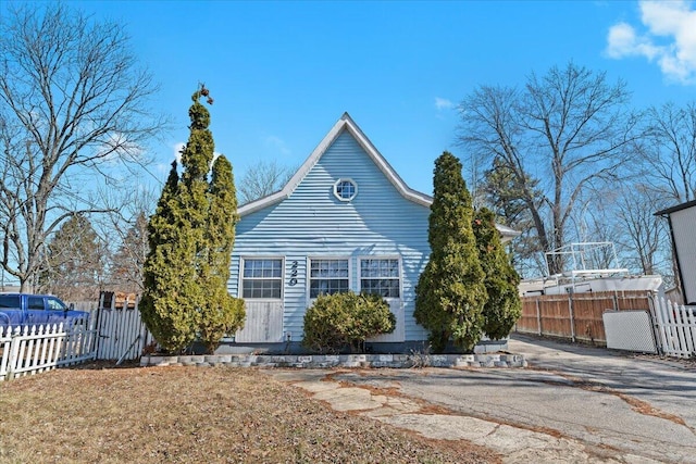 view of property exterior featuring fence