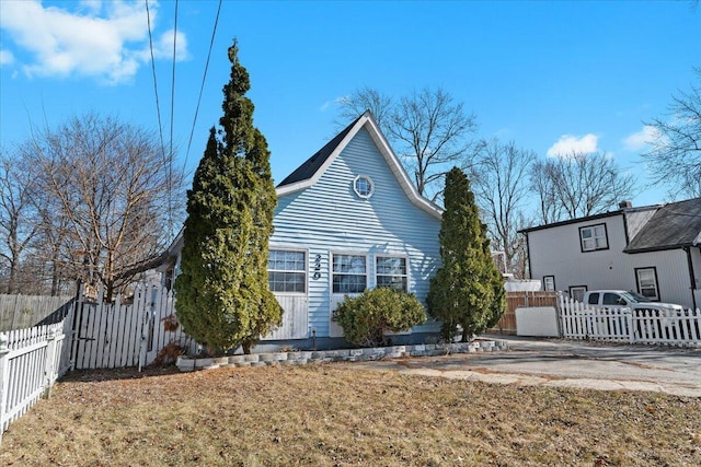 view of side of home featuring fence