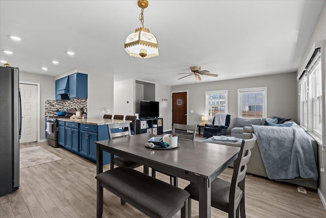 dining area featuring recessed lighting, light wood-style floors, baseboards, and ceiling fan