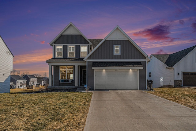 view of front of house featuring brick siding, an attached garage, board and batten siding, a front lawn, and driveway