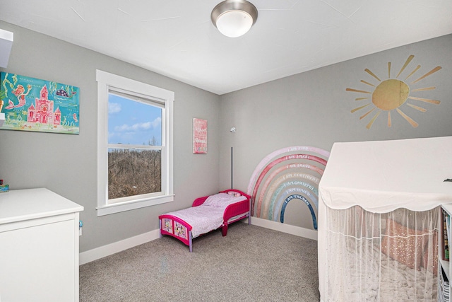 bedroom featuring baseboards and carpet