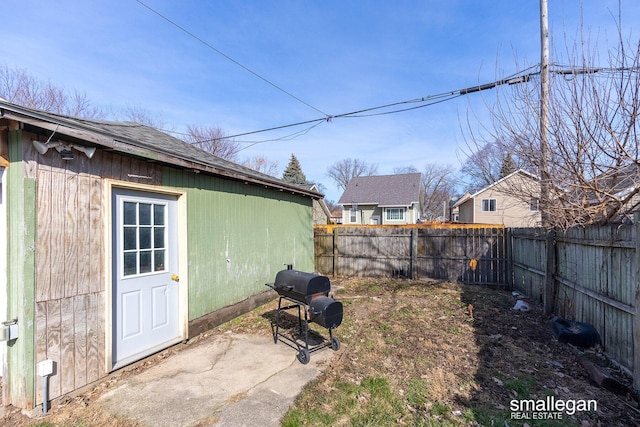 view of yard with an outbuilding and a fenced backyard