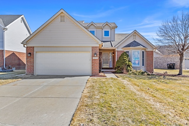 view of front of home with a garage, a front yard, brick siding, and driveway