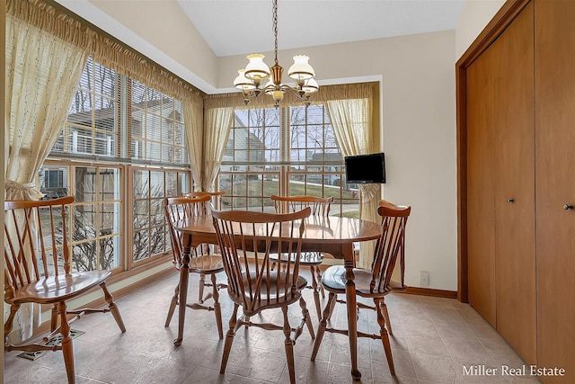 dining room featuring a chandelier, baseboards, and light tile patterned flooring