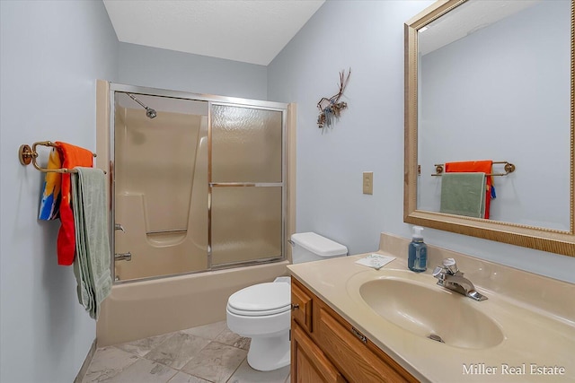 full bath featuring toilet, vanity, and shower / bath combination with glass door