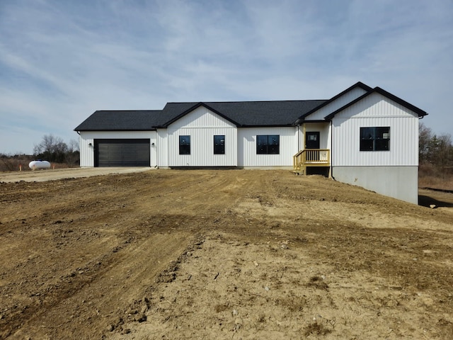 modern farmhouse featuring a garage