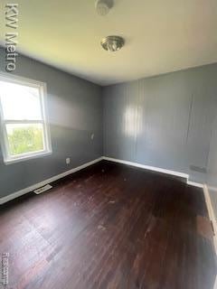 6390 Faust Ave, Detroit, MI 48228 - empty room featuring dark wood-style flooring and baseboards