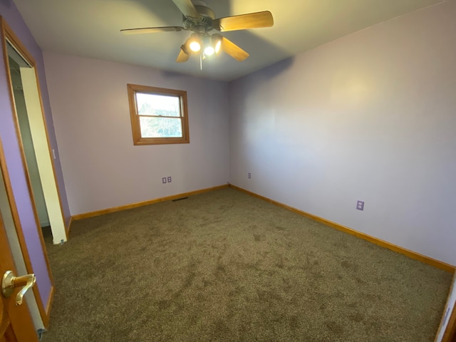 unfurnished bedroom with baseboards, a ceiling fan, and carpet flooring