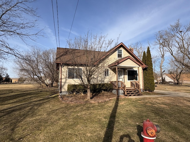 bungalow-style home with a chimney and a front lawn